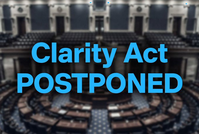 The image displays the bold blue text "Clarity Act POSTPONED" overlaid on a blurred photograph of the U.S. House chamber, visually reinforcing the news that the Clarity Act vote has been delayed, with the Senate set to reconvene on September 14.