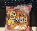 A package of Korean snacks featuring a cartoon bear mascot with Korean text on a red wrapper.
