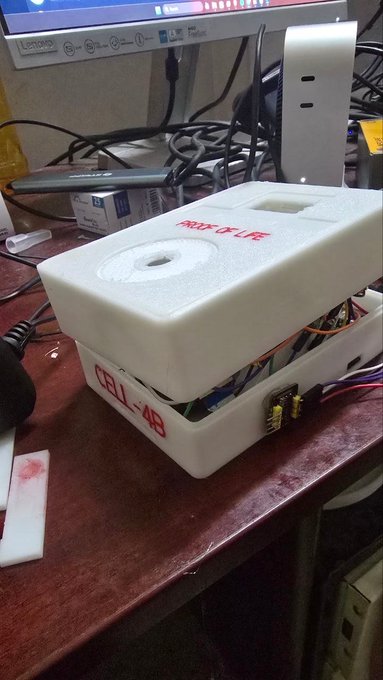 A 3D-printed white plastic enclosure on a desk labeled 'MIXTAPE' in red on top and 'CELL 48' on the side, with exposed wiring and electronics visible inside.