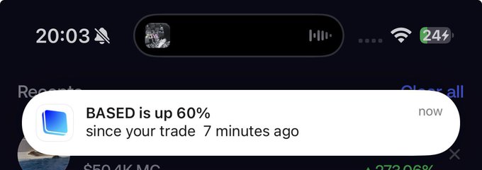 A smartphone notification from the Base app displays "BASED is up 60% since your trade 7 minutes ago," congratulating the user on a profitable trade, which aligns with the post praising the Base app by @brian_armstrong and @cobie.