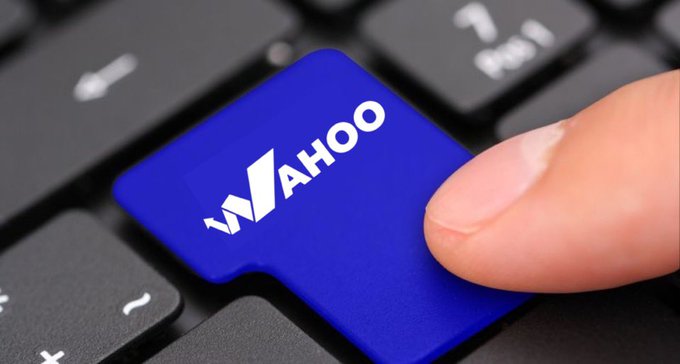 A finger presses a blue "WAHOO" branded key on a black keyboard, visually tying to the post's introduction of Wahoopredict—a platform that turns predictive insights into market signals across sports, gaming, crypto, and real-world events.