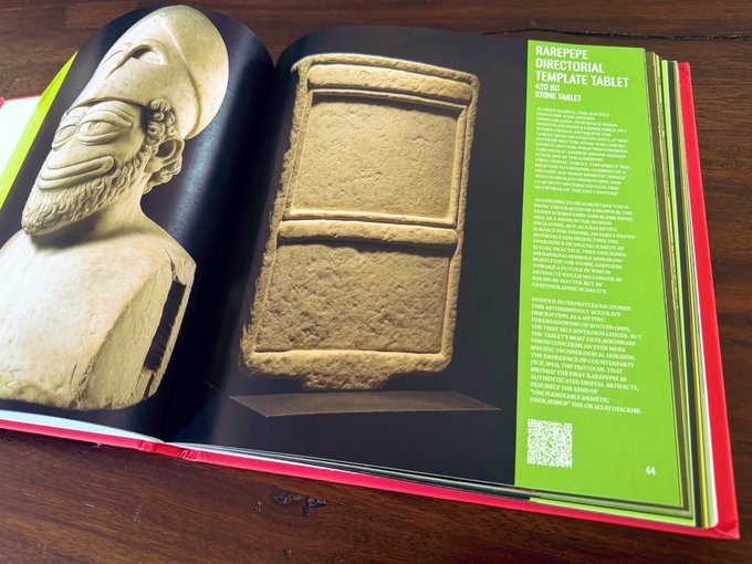 An open book or magazine page displaying an article titled 'RAREPEPE DIRECTORY: TEMPLATE TABLET' alongside images of a stone bust and a rectangular stone tablet.