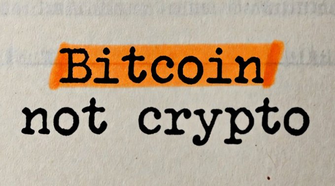 The image features a white background with black text that reads "Bitcoin Not Crypto". This message seems to be written by someone, possibly an artist or a user of the platform who wanted to express their thoughts about Bitcoin. The phrase "No crypto" is used as a metaphor for the idea that Bitcoin is not a real cryptocurrency.