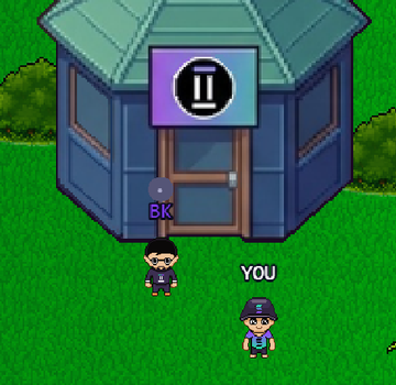 The image features a small blue building with a sign that reads "II". There are two people standing outside of this building, one wearing a black shirt and glasses and the other wearing a blue hat. The text in the image suggests that there is still time to register for the Season 2 of @indiesonsolana Are you building something exciting in gaming? This is for you! Talk to @JustBKhere while walking in the city and register your project!.