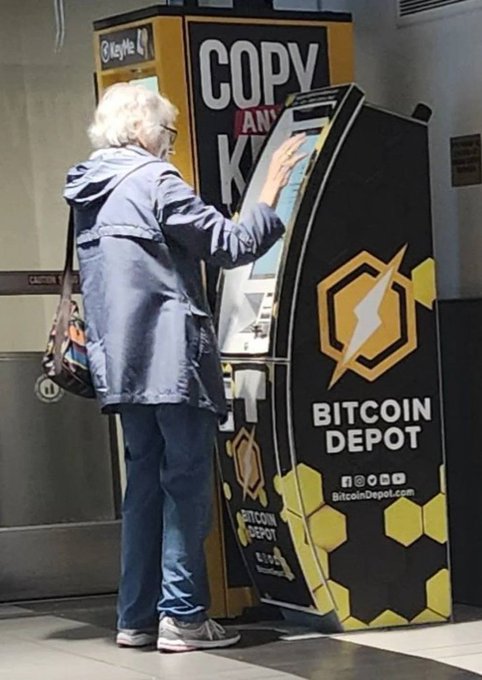 An elderly woman in a blue coat uses a Bitcoin Depot ATM kiosk in what appears to be a shopping mall. The image humorously illustrates the post about the parents' belated interest in Bitcoin after its price surge, despite the advice to buy a year earlier at $126k.