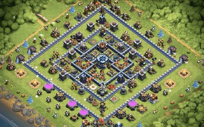 An aerial view of a highly structured, symmetrical base layout from the game Clash of Clans, featuring concentric diamond walls and various defensive structures.