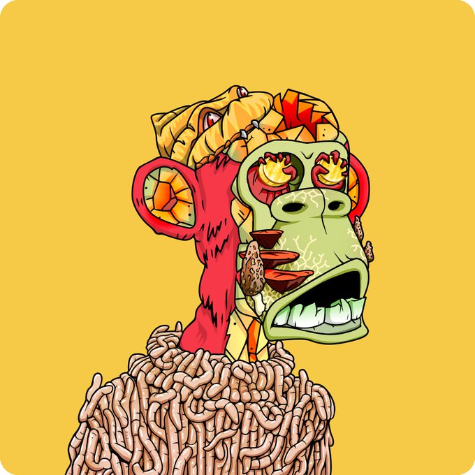 A colorful cartoon illustration of a monkey head with a green face, red flames, and bulging yellow eyes, appearing to scream, with a body made of worms against a yellow background.
