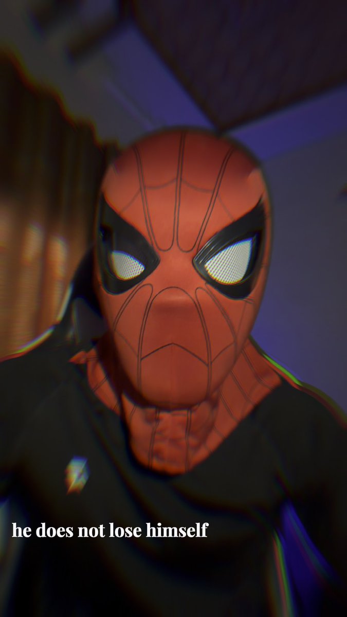 A close-up of Spider-Man in his red and black suit with glowing white eyes, accompanied by the text 'he does not lose himself.'