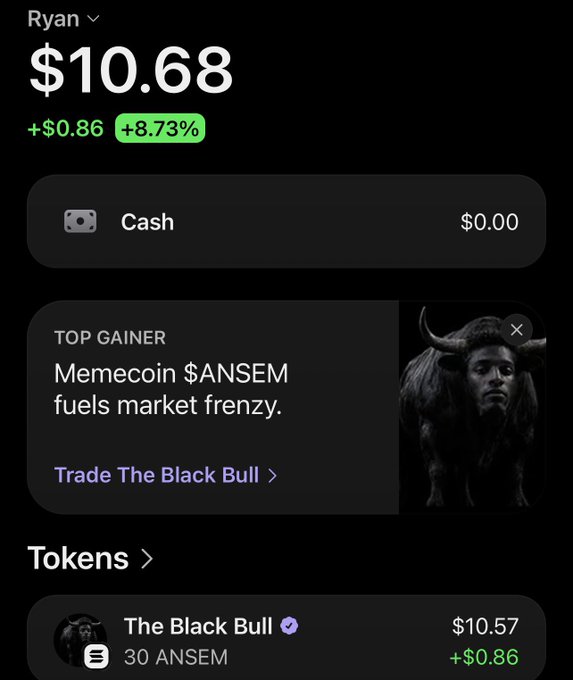Mobile trading app screen for user 'Ryan' showing $10.68 balance, +8.73% gain, featuring 'The Black Bull' token holding 30 ANSEM and top gainer banner for 'Memecoin $ANSEM'.