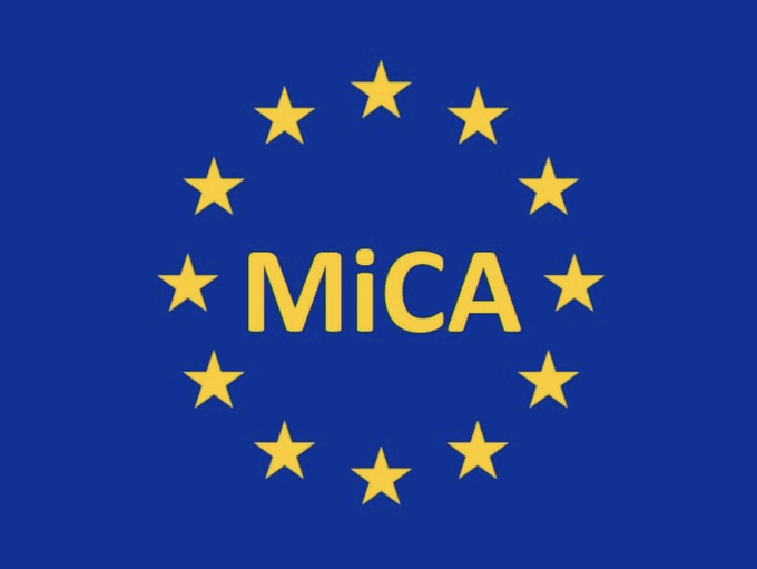 The image displays the MiCA logo—featuring gold "MiCA" text surrounded by a circle of yellow stars on a blue background, echoing the EU flag's design—tying directly to the post about EU regulators warning of crypto scams exploiting the Markets in Crypto-Assets regulation framework.
