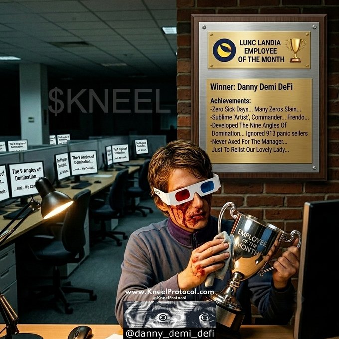 Meme-style image showing a man wearing 3D glasses with a bloody nose holding an 'EMPLOYEE OF THE MONTH' trophy, with a plaque reading 'LUNC LANDIA EMPLOYEE OF THE MONTH - Winner: Danny Demi DeFi' listing achievements including 'Zero Sick Days... Many Zeros Slain' and 'Developed The Nine Angles Of Domination... Ignored 913 panic sellers.' Branded with $KNEEL and '@danny_demi_defi'.