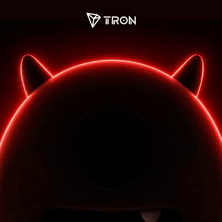 The image features a red neon-lit object with a face design that looks like a monster or devil's head. The background of the image is black, which contrasts with the bright red color of the object. There are two words written on the image in white text at the top and bottom corners - "TRON" and "Only 3 days left". These words suggest that there might be an upcoming event or promotion related to the TRON brand. The design of the neon-lit object, combined with the black background and white text, creates a striking visual effect that draws attention to the image.