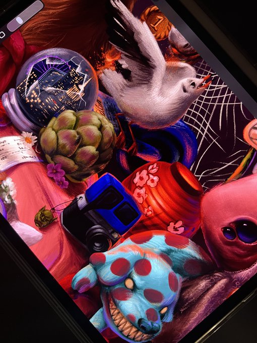 A colorful surreal digital illustration displayed on a phone screen, featuring a white bird, a doll, an artichoke, a blue toy, and a blue stuffed animal with red polka dots.
