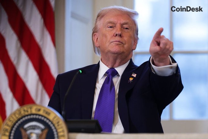 In this image from CoinDesk, former President Donald Trump points forward in front of the U.S. flag. The image is relevant as a new version of the Digital Asset Market Clarity Act is circulating, indicating significant legislative developments for the crypto industry.