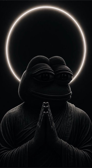 A dark, stylized image of a contemplative frog-like figure in prayer pose wearing robes, illuminated by a glowing halo ring against a black background.