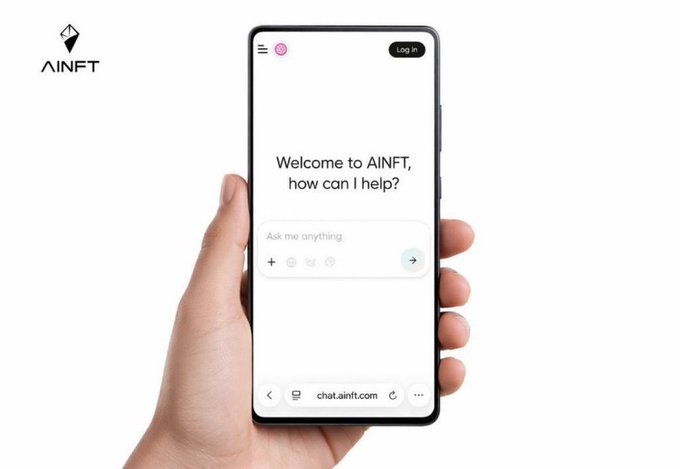 A hand holding a smartphone displaying the AINFT chat interface with the welcome message 'Welcome to AINFT, how can I help?' and the AINFT logo visible in the top left corner.