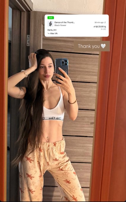A mirror selfie of a woman wearing a white Calvin Klein bralette and patterned pants, with a screenshot overlay of a Spotify receipt for 'Dance of the Thund...' and 'Black Flower' by Daria_art, totaling 23.00.