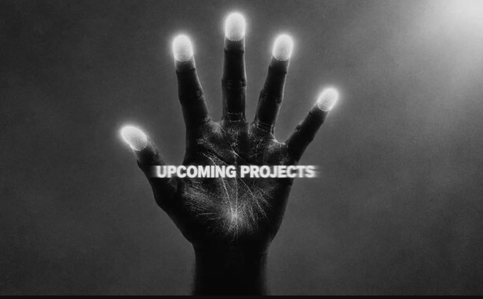 Dark image of a hand with glowing fingertips and a bright center, overlaid with the text 'UPCOMING PROJECTS'.