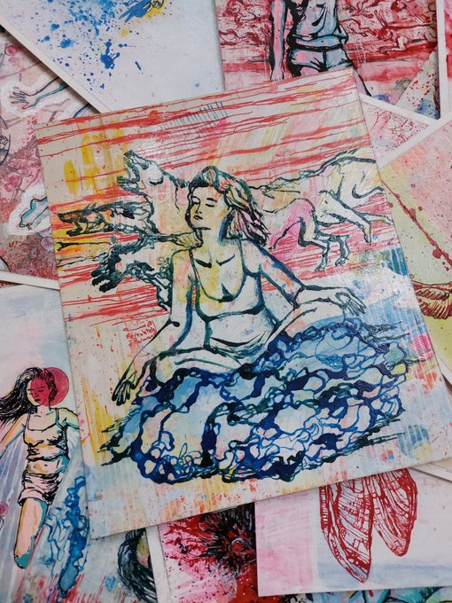 A pile of colorful, hand-drawn artwork featuring expressive figures of women and girls sketched in ink and watercolor.