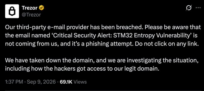 A tweet from Trezor (@Trezor) warning users of a security breach: "Our third-party e-mail provider has been breached. Please be aware that the email named 'Critical Security Alert: STM32 Entropy Vulnerability' is not coming from us, and it's a phishing attempt." The tweet is dated 1:37 PM - Sep 9, 2026 and has 69.1K Views.