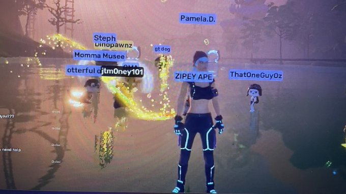 A screenshot from a virtual world or video game shows an avatar in neon-lined black gear standing in a glowing, hazy environment surrounded by other avatars with nametags like "Pamela.D.", "Momma Musee", "ZIPEY APE", and "ThatOneGuyOz".