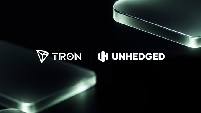 A dark promotional graphic displays the TRON and UNHEDGED logos, with a glowing rounded device partially visible against a black background.