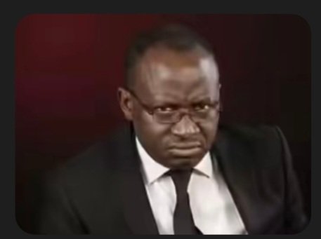 A reaction image/GIF featuring a man in a suit and tie making a deeply skeptical, displeased facial expression.