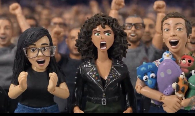 Three stylized figurines with expressive, excited faces are displayed against a backdrop of a cheering crowd, with the central figure sporting a black leather jacket and curly hair, flanked by a glasses-wearing woman and a person clutching stuffed creatures, fitting the post's reference to the "MadLads" NFT collection and its punk rock aesthetic.