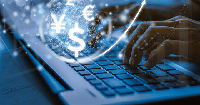 A person types on a laptop keyboard with floating currency symbols (¥, $, €) and an upward arrow, symbolizing digital finance and crypto transactions—visually representing the article's theme of cryptocurrency payments via JPYC, as discussed by Takafumi Horie with JPYC CEO Okabe at WebX.