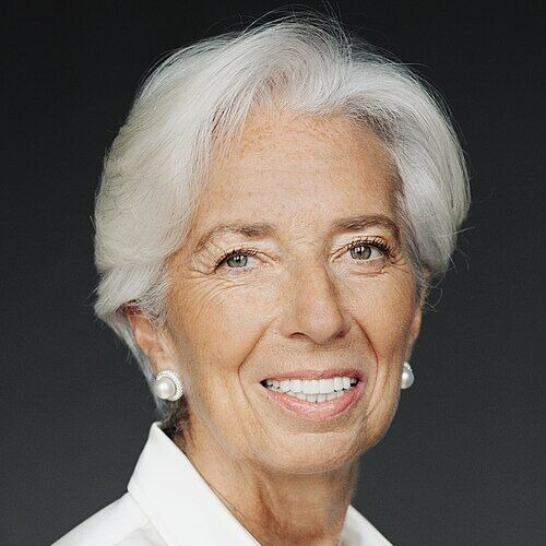 A headshot of Christine Lagarde, President of the European Central Bank, smiling with short silver hair and pearl earrings against a dark background. The image relates to the post as she leads the ECB, which is launching the Pontes digital euro platform pilot phase.