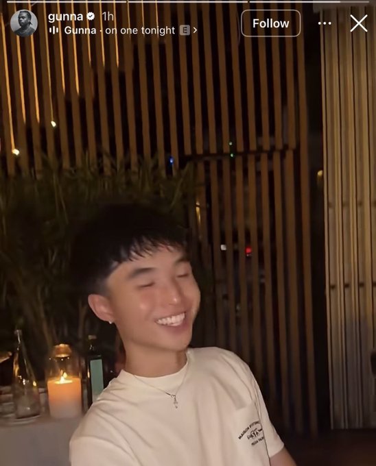 The Instagram story, posted by "gunna" 1 hour ago with the audio "Gunna · on one tonight," shows the rapper smiling in a dimly lit restaurant setting, providing visual context to the accompanying post's skepticism about rappers' relationships with crypto promoters.