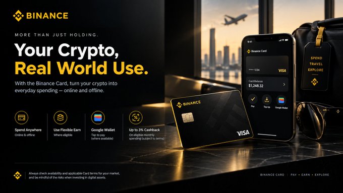 The image is a Binance advertisement featuring a physical Binance Visa Card alongside a smartphone displaying the card's app interface with a balance of $1,348.32, set against a travel-themed backdrop with a "SPEND, TRAVEL, EXPLORE" luggage tag.

The visual reinforces the post's message by showcasing practical, real-world crypto utility—highlighting features like "Spend Anywhere" online/offline and "Up to 3% Cashback"—rather than just holding assets.