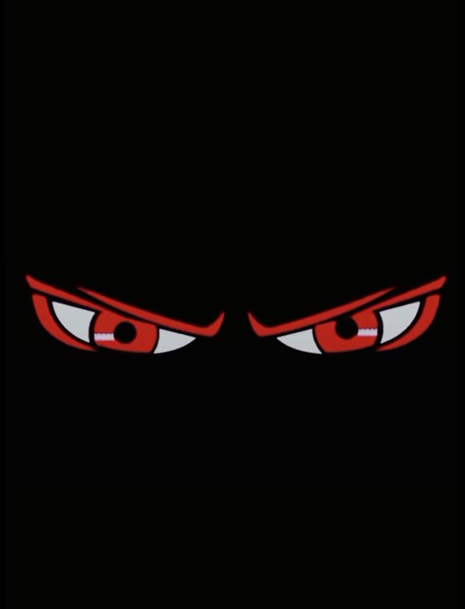 A minimalist black image featuring only a pair of angry, stylized red and white anime-style eyes peering out from darkness.
