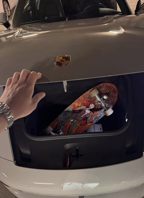 The image shows a person's hand reaching into a car trunk, where an orange skateboard with a black design is placed inside. The background of the photo appears to be a gray wall or garage door. There are no other objects visible in the scene, and the focus on the skateboard suggests that it might be a popular item among skateboarders.

The caption "Keep accumulating $XRP" implies that there may be an ongoing transaction involving the skateboarder's payment for the skateboard using Bitcoin or another cryptocurrency. The image could potentially be related to a discussion about the value of skateboards, the rise in popularity of skateboarding culture, or even the use of digital currency in transactions within the skateboarding community.