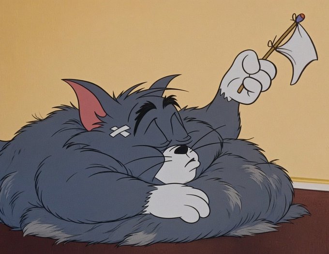 A classic cartoon scene featuring Tom the cat, who has a bandage on his face, sleeping while resting his head on his paw with a white flag raised in surrender.