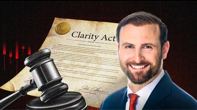 Patrick Witt stands smiling in a suit and red tie beside a gavel and a document titled "Clarity Act," with a candlestick chart in the background, visually reinforcing the post's claim that the White House is pushing to pass the Crypto CLARITY Act next month.