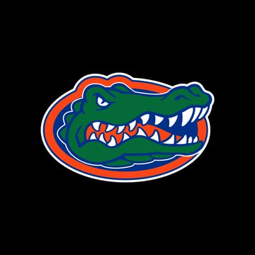 A Florida Gators logo featuring the team's iconic green alligator head with bared teeth, encircled by orange and white borders, set against a black background. The image represents the University of Florida, the new partner of Ripple (XRP) for stadium signage at Ben Hill Griffin Stadium.