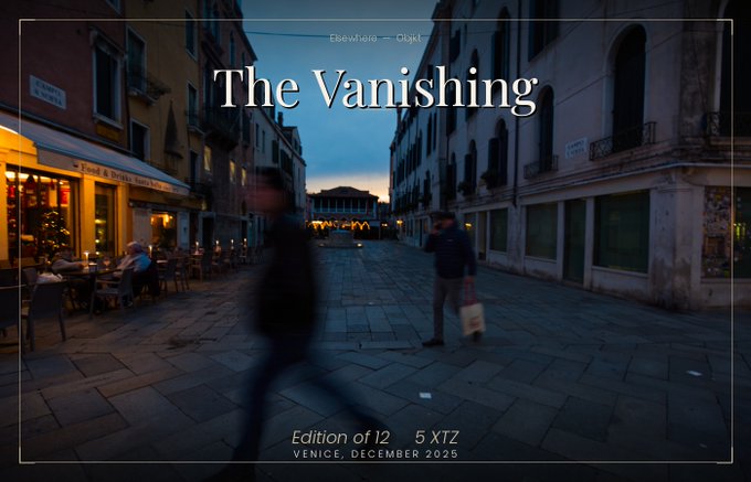 The image shows a city street at night with two people walking down the sidewalk, one of them carrying a bag. There are several buildings visible in the background, including a restaurant that has outdoor seating. The text "The Vanishing" appears multiple times throughout the image, suggesting it is related to an art project or exhibition.