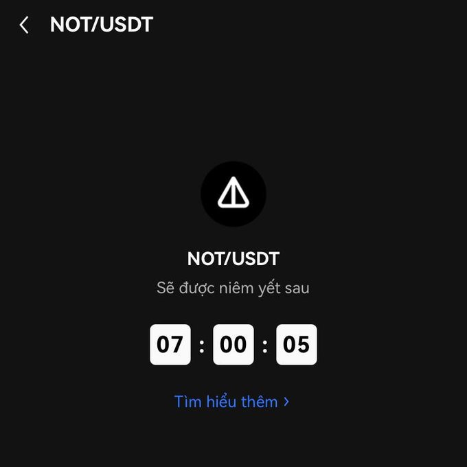 A countdown screen showing NOT/USDT will be listed in 07:00:05 hours, with a 'Tìm hiểu thêm' (Learn more) link in Vietnamese.