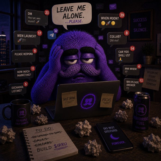 The image features a bored, purple, fuzzy character sitting at a desk surrounded by chaotic notification bubbles, crumpled paper balls, and a laptop labeled "NOT NOW" and "FOCUS." A "TO DO" notepad reads "Respond to DMs, calls, collabs, BUILD $IRRU," alongside an energy drink marked "ABURRIDO FUEL" and a phone displaying "DO NOT DISTURB FOREVER." The scene perfectly mirrors the post's message of ignoring hype and distractions to focus on building the $IRRU meme project, embodying the "El Aburrido" (the bored one) persona dedicated solely to creation over empty promises.