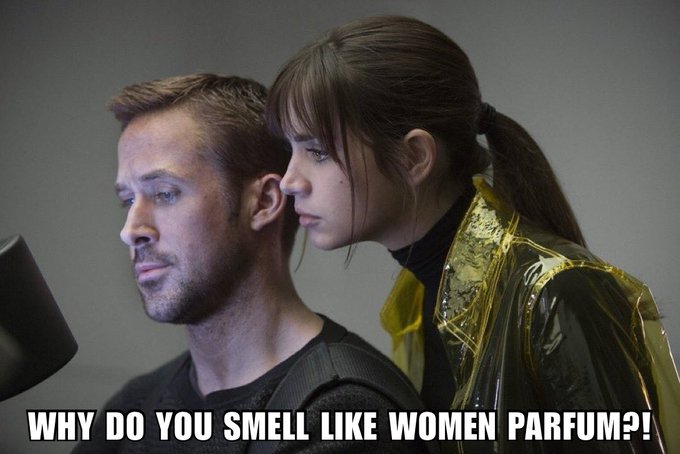 A humorous edited image shows a man and a woman standing close together, with the woman behind the man wearing a transparent yellow raincoat, captioned at the bottom: 'WHY DO YOU SMELL LIKE WOMENS PARFUM?!'