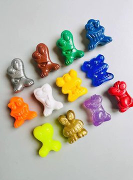 A colorful assortment of small plastic figurines—including figures in blue, green, red, yellow, orange, white, silver, and purple—scattered across a white surface, resembling the various "ingredients" or pieces needed for the "God Pull Omens" recipe described in the post.