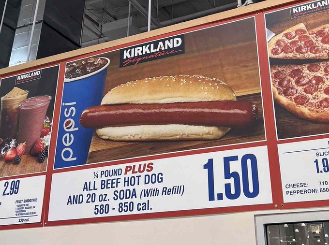 A menu board at Costco's food court advertises the iconic ¼ Pound Plus All Beef Hot Dog and 20 oz. Soda with Refill combo for just $1.50, alongside other items like a fruit smoothie for $2.99 and slices of pepperoni pizza for $1.50 each. The post references how this beloved low-priced combo could potentially be purchased with just one $FLR token in the future.