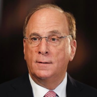 A close-up portrait of BlackRock CEO Larry Fink wearing rimless glasses, a dark suit, white shirt, and pink patterned tie against a dark background. The image relates to the post highlighting BlackRock's ETFs purchasing $117.4 million in Bitcoin and $57.8 million in Ethereum, with Fink's leadership of the firm central to the significant crypto investments and broader market inflows of nearly $1 billion into Bitcoin Spot ETFs.