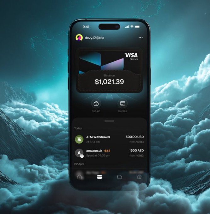 The image shows a smartphone displaying a fintech/banking app with a Visa Platinum card, a balance of $1,021.39, and transaction history including an ATM Withdrawal of 500.00 USD and an amazon.uk +$1.5 (1500 AED) purchase, set against a dramatic cloudscape background.

The caption connects to the post by visualizing Tria's digital payment infrastructure—showcasing the app interface where cross-chain transactions and balances are managed, symbolizing the seamless financial execution that the Pathfinder Network aims to optimize through community-driven routing.