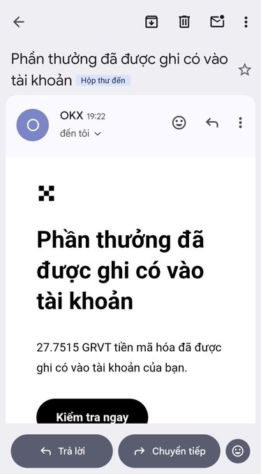 A mobile email notification from OKX in Vietnamese stating 'Rewards have been credited to your account' showing 27.7515 GRVT encrypted tokens received.