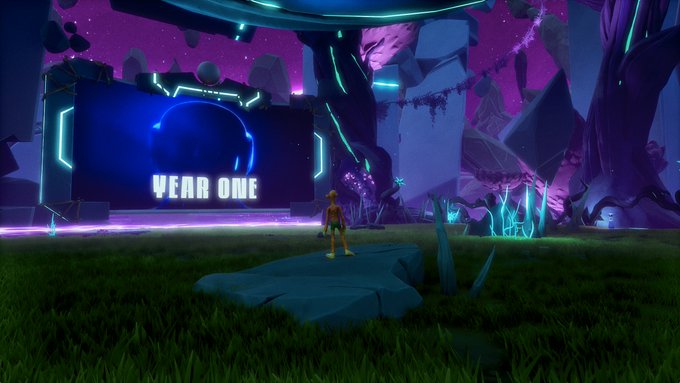 A figure stands before a large screen displaying "YEAR ONE" in a vibrant, futuristic landscape, hinting at a celebration or event.