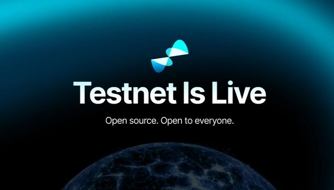 A promotional graphic featuring a blue and teal logo with the text 'Testnet Is Live' and 'Open source. Open to everyone.' displayed against a dark background with a glimpse of Earth at the bottom.