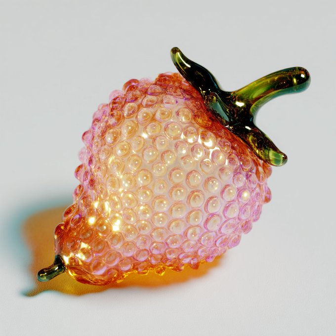 A glossy glass sculpture of a strawberry with a textured bubble pattern, displayed in pink and orange hues with green stems against a light background.