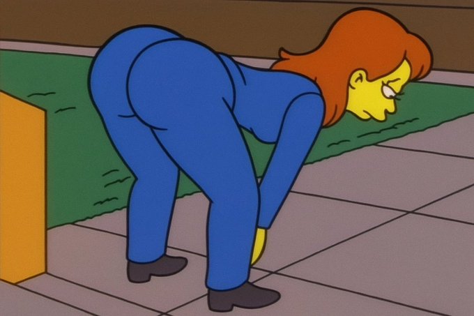 Cartoon image of a character with orange hair wearing a blue outfit, bent over with hands on knees in a hunched posture.